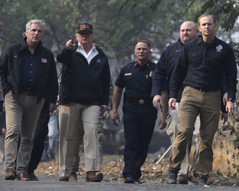 Death toll rises to 76 in California fire as Trump visits