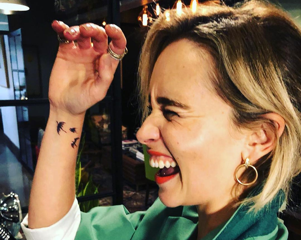 Emilia Clarke shows off dragon tattoos