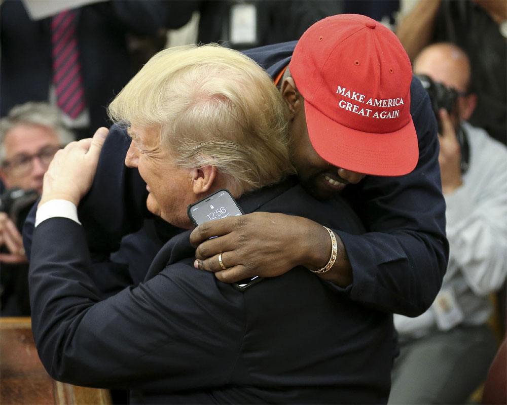 Kanye West hugs Trump, muses on presidential run