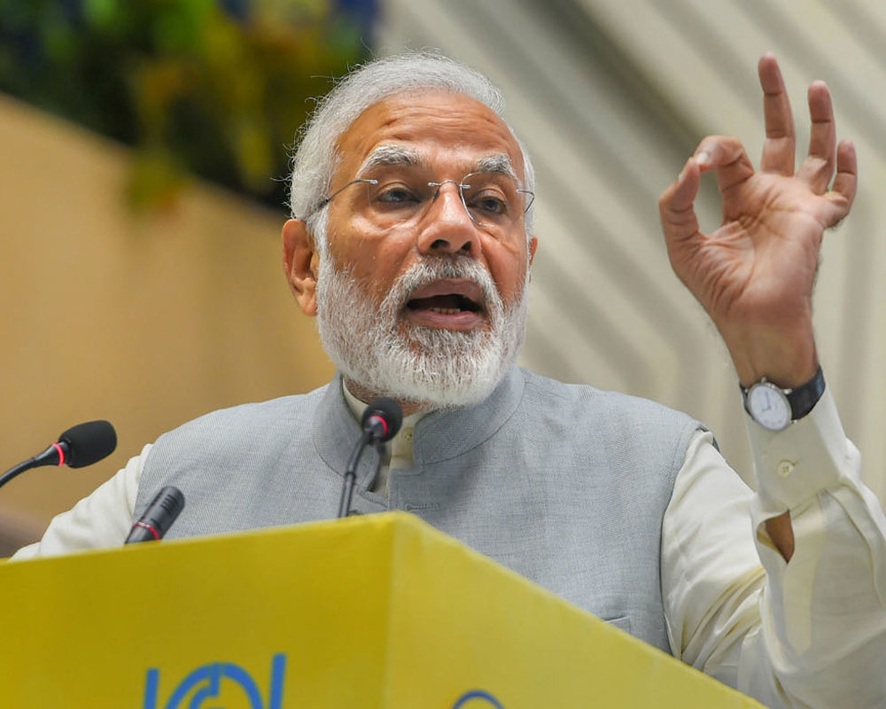 Modi calls for 'tax-plus one' system of honest tax payment, doing extra for society