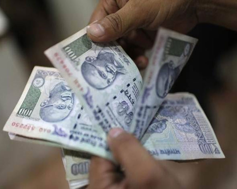 Rupee gains 6 paise against US dollar
