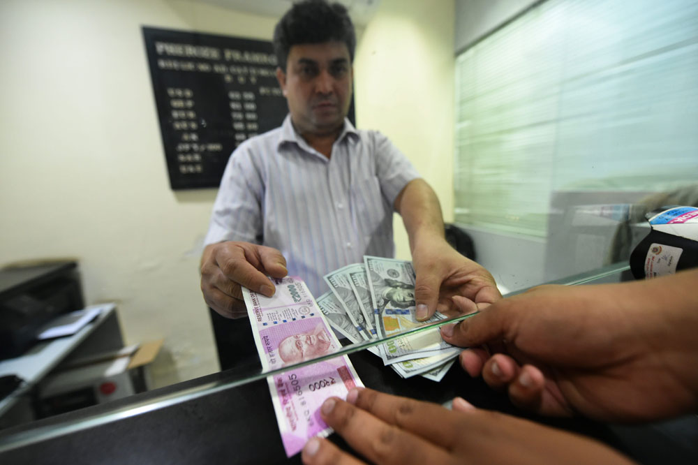 Rupee pares gains, slips 7 paise against US dollar