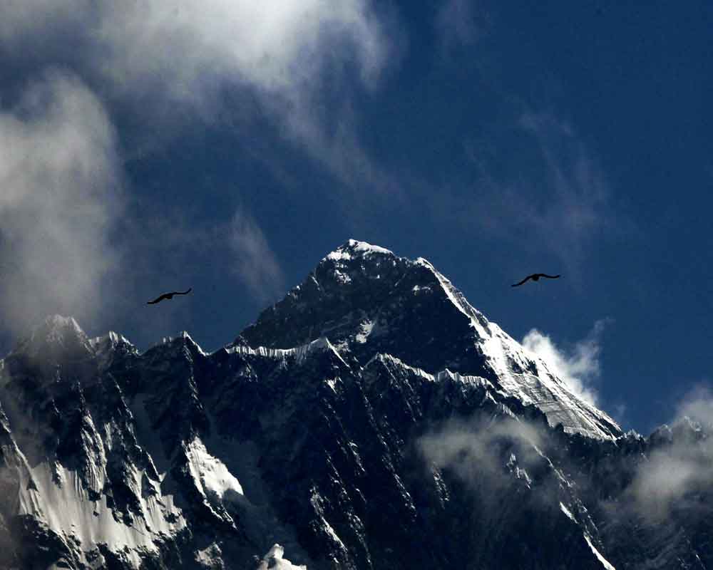 Deaths rise as Nepal issues more permits for Mount Everest