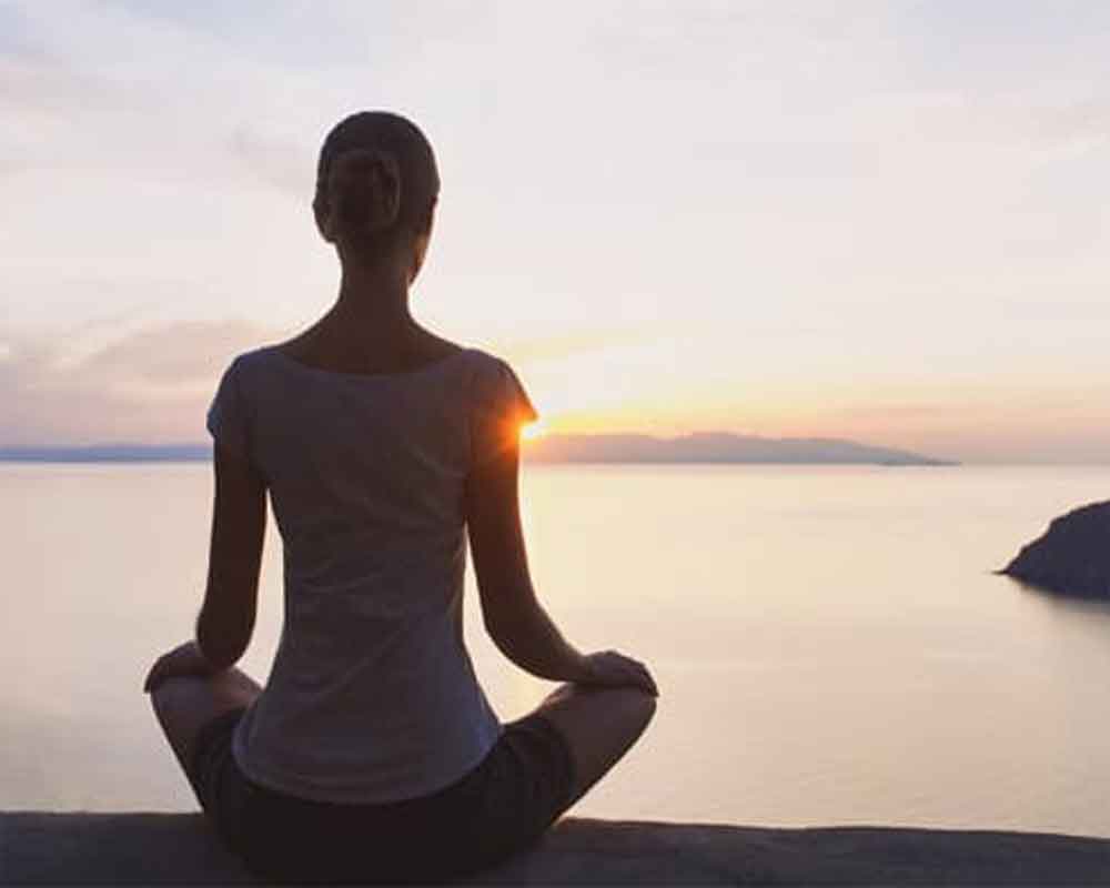 A woman is doing heartfulness meditation