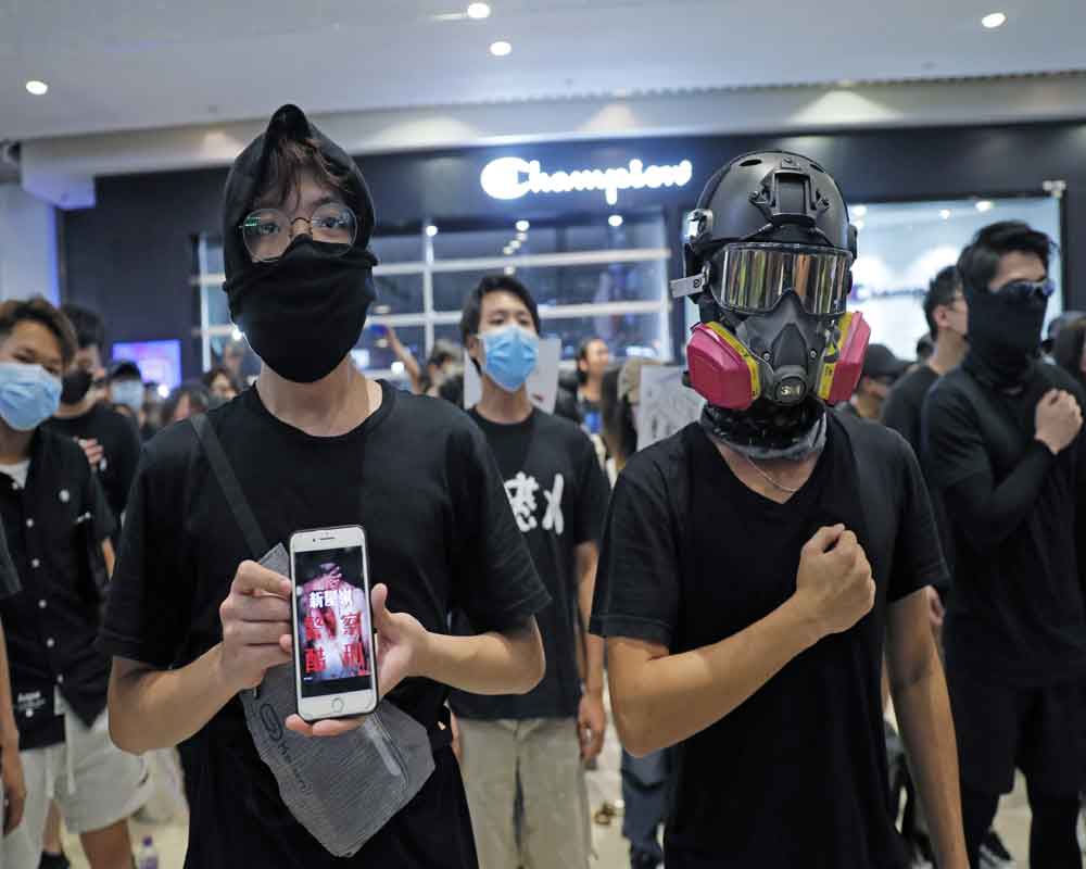 Hong Kong curbs airport links as protesters vow 'stress test'