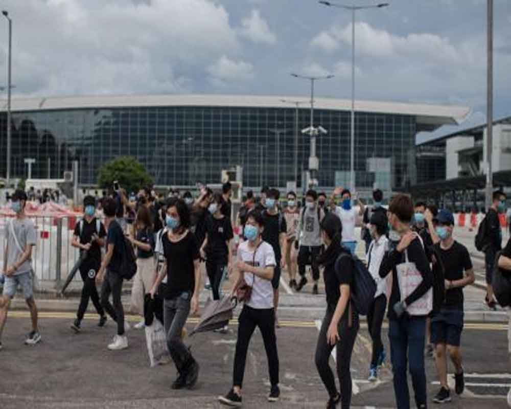 Riot police deployed as Hong Kong protesters target airport