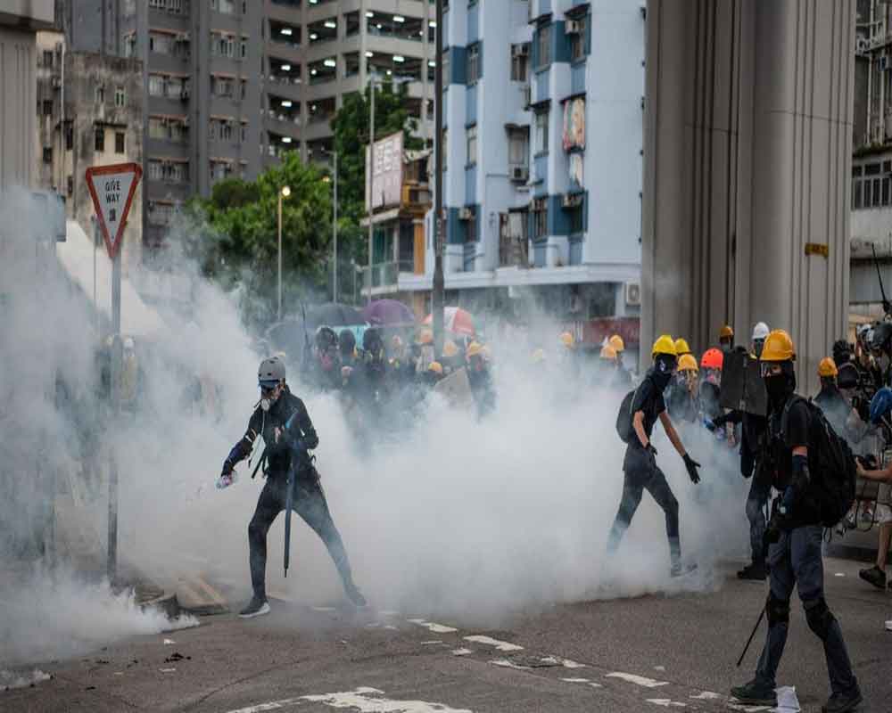 Flouting ban, Hong Kong protesters flood city streets