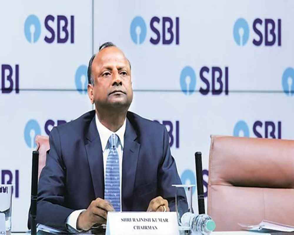 Indian economy in transition phase, growth to come back: SBI Chairman