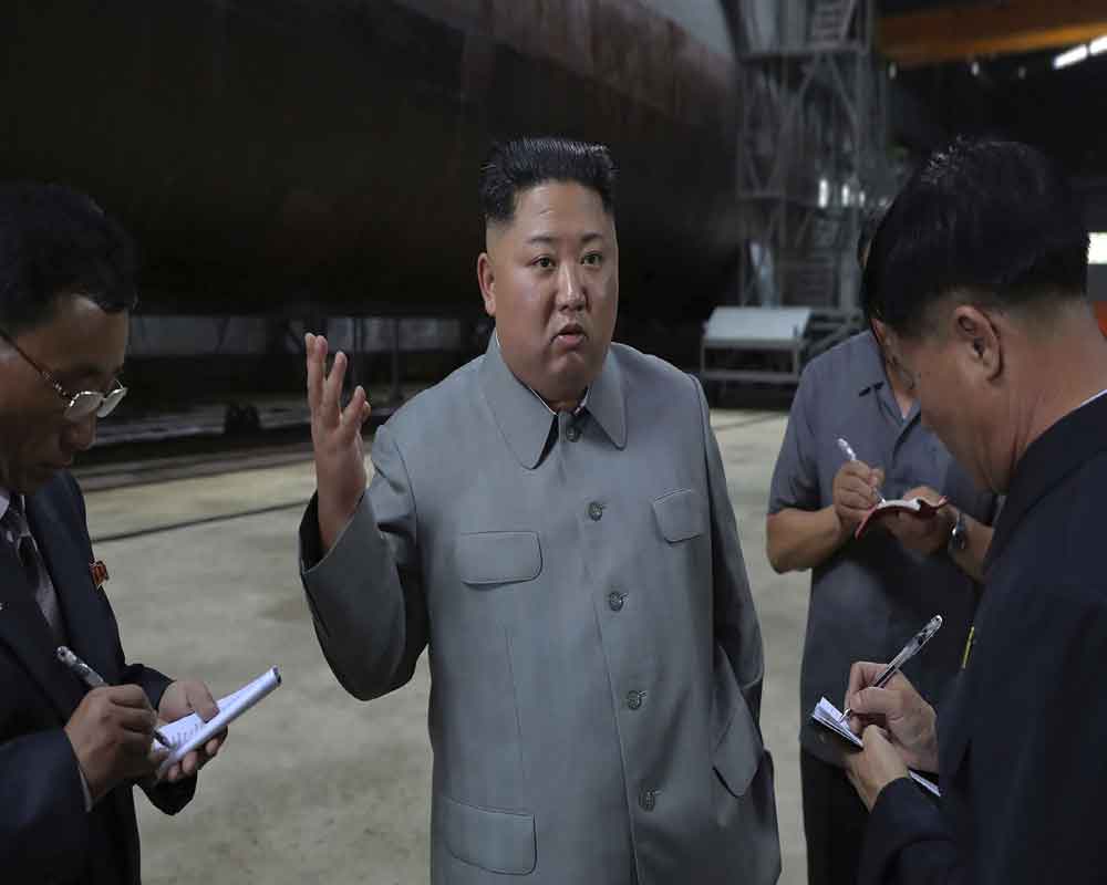 Kim inspects new submarine, wants NKorean military bolstered