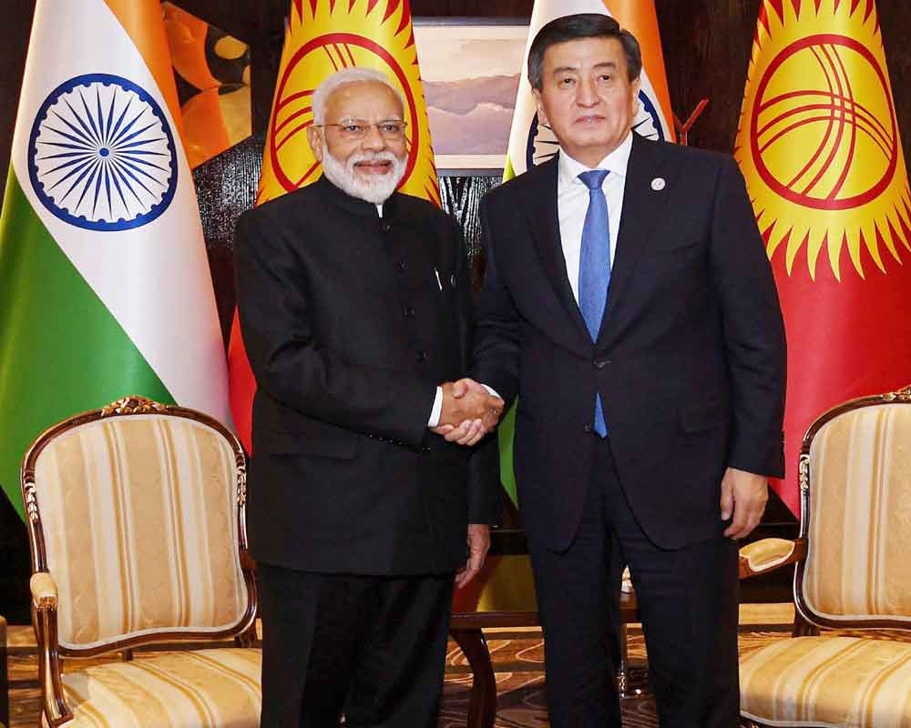 Kyrgyzstan President gifts traditional hat, coat to PM Modi