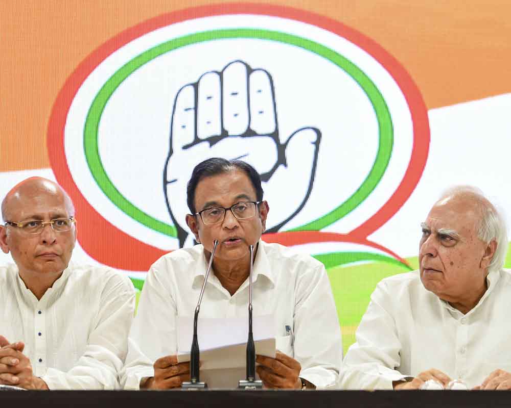 Not hiding from law, says Chidambaram at Congress HQ