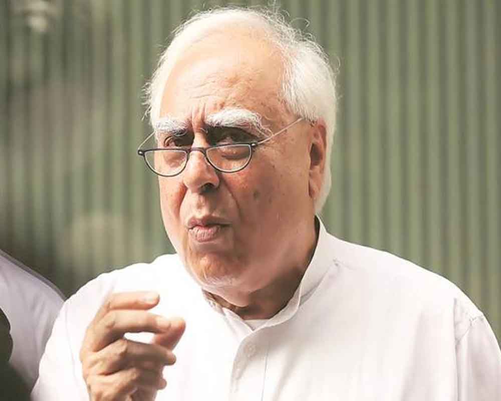 PM should attend to work, have less photo ops: Sibal