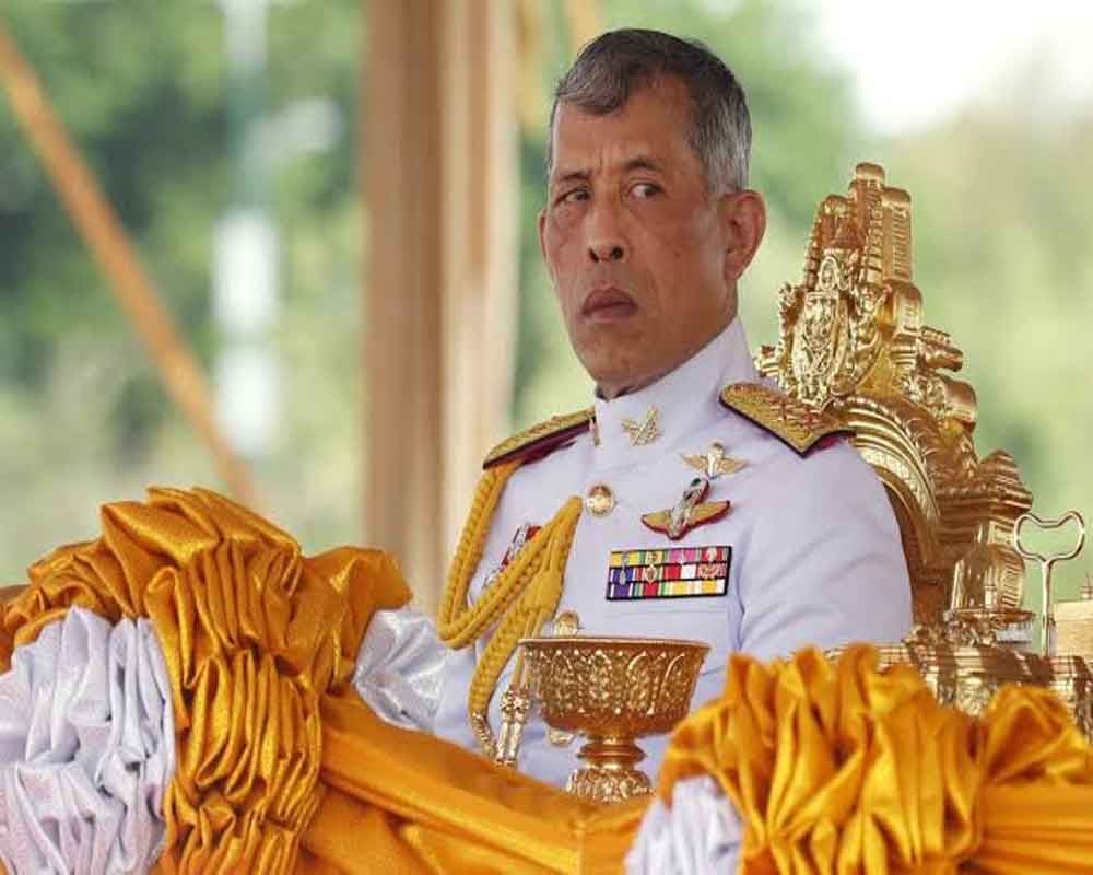 Thai king fires royal guards for 'adultery'
