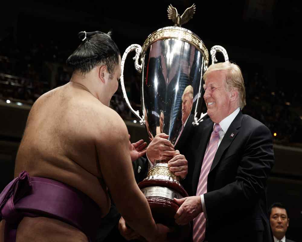 Trump awards trophy at marquee sumo event in Tokyo