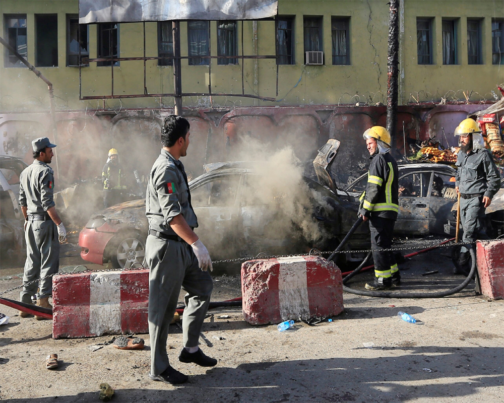 Afghan officials say 34 killed in separate suicide bombings