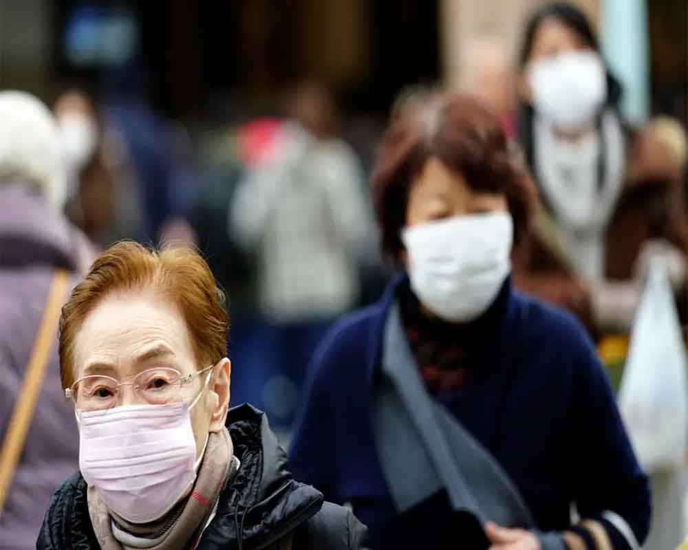 China says virus spreading between humans as WHO set to meet
