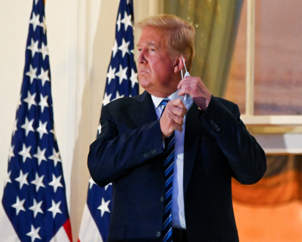 Trump no longer considered transmission risk to others, says his doctor