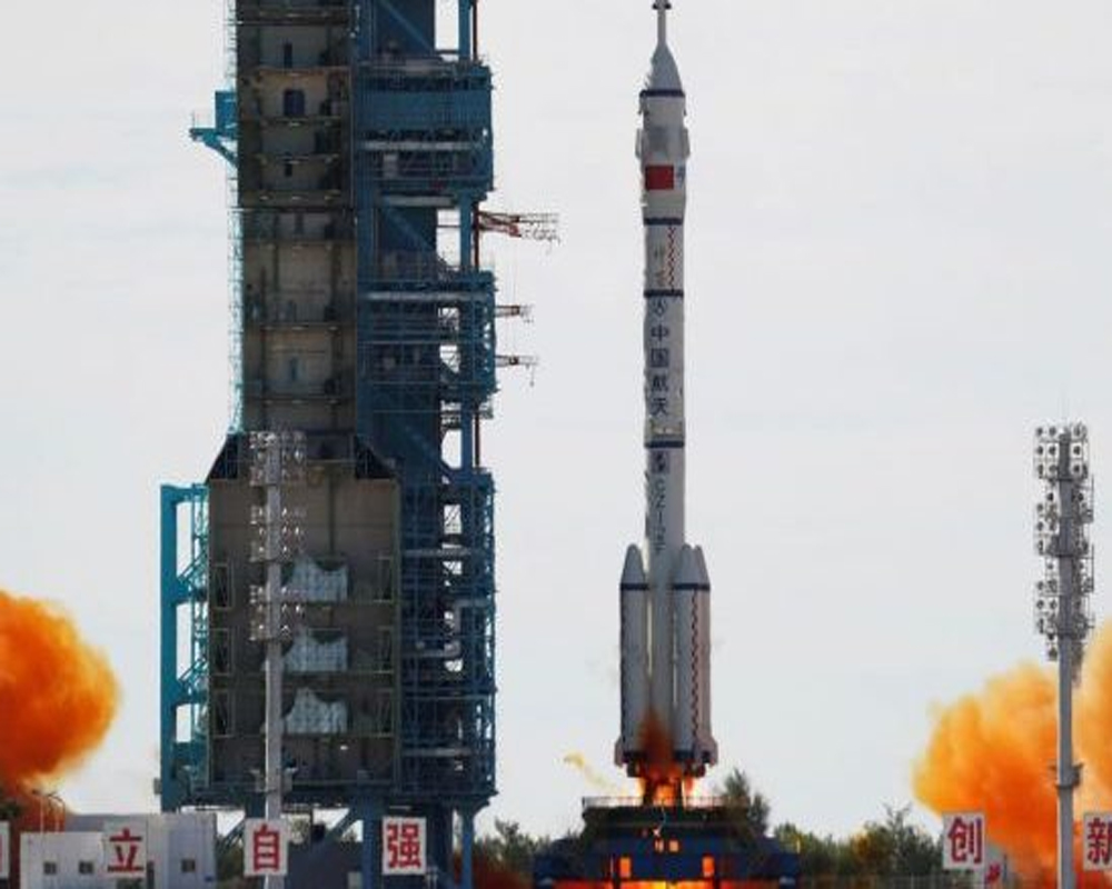 Chinese crewed spaceship docks with new space station