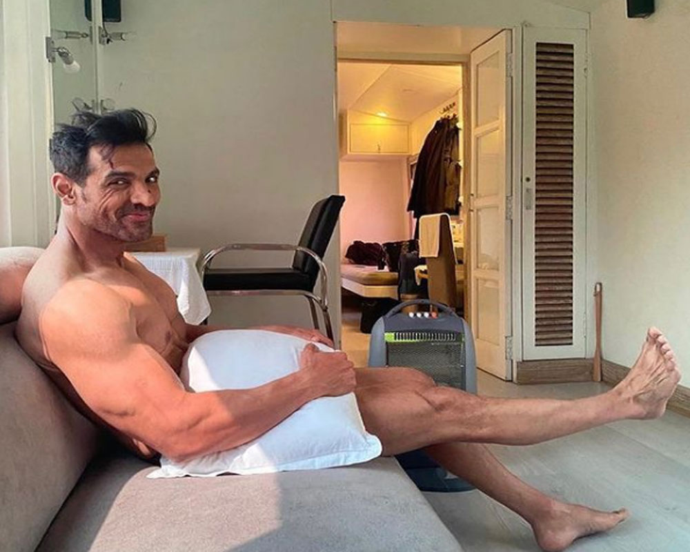 John Abraham is 'waiting for wardrobe', poses with just a pillow!