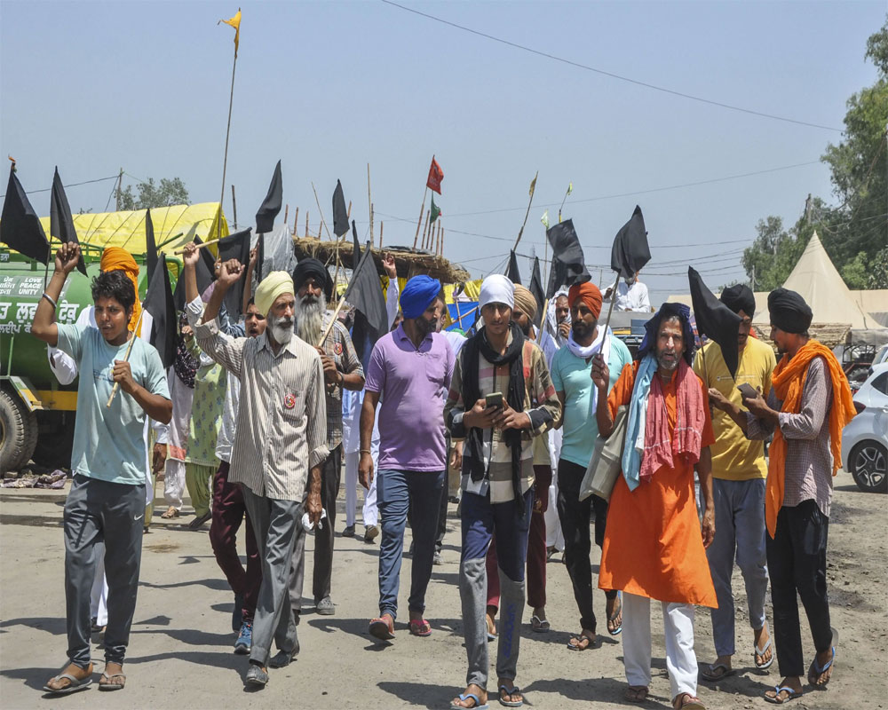 Protest flags, slogans and marches as farmers observe 'black day' to mark 6 months of stir