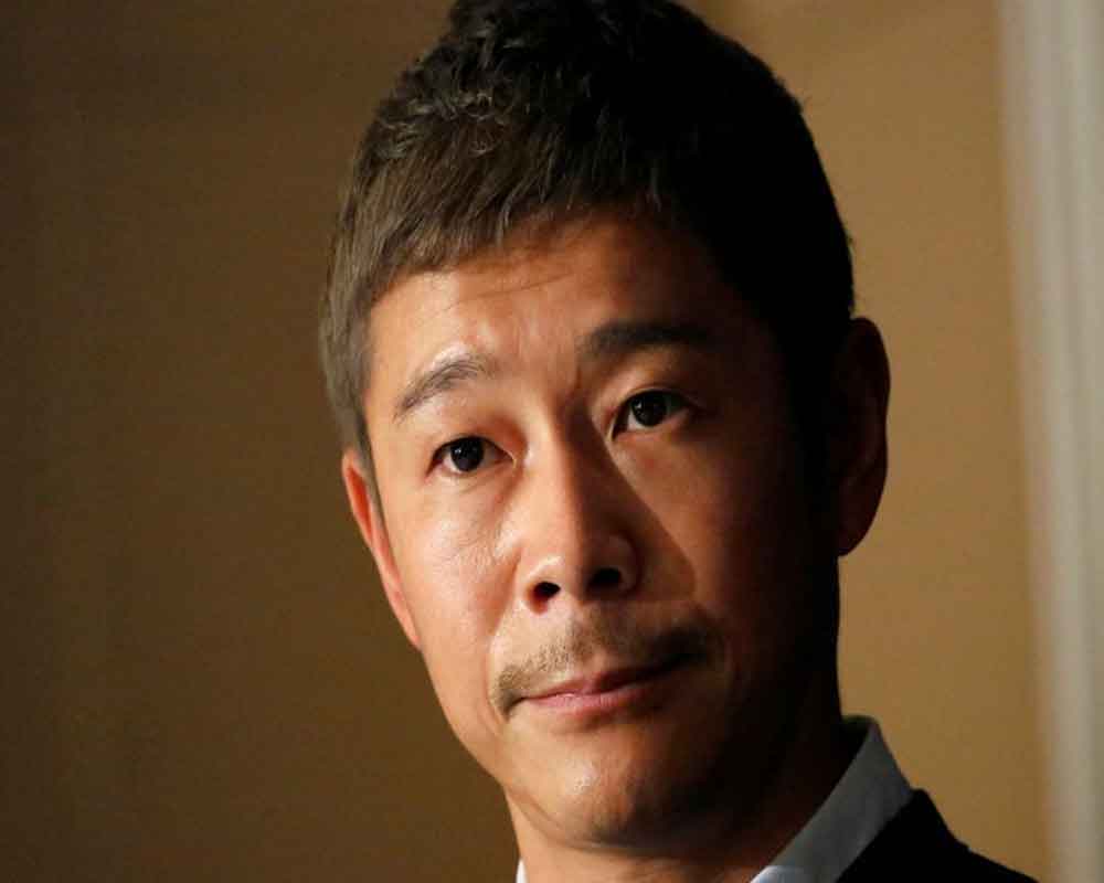 Japan tycoon Maezawa returns from space with business dreams