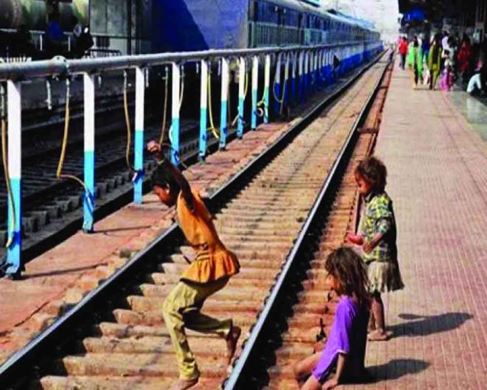 perils of children on  railway platform