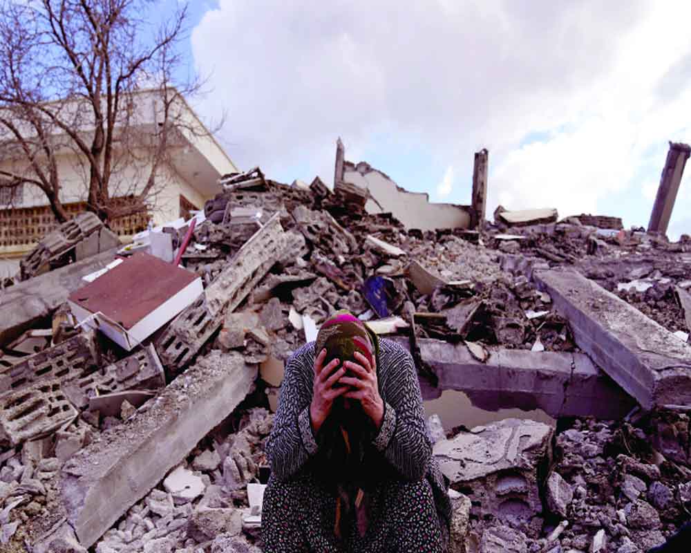 Voices crying out from quake rubble fall silent
