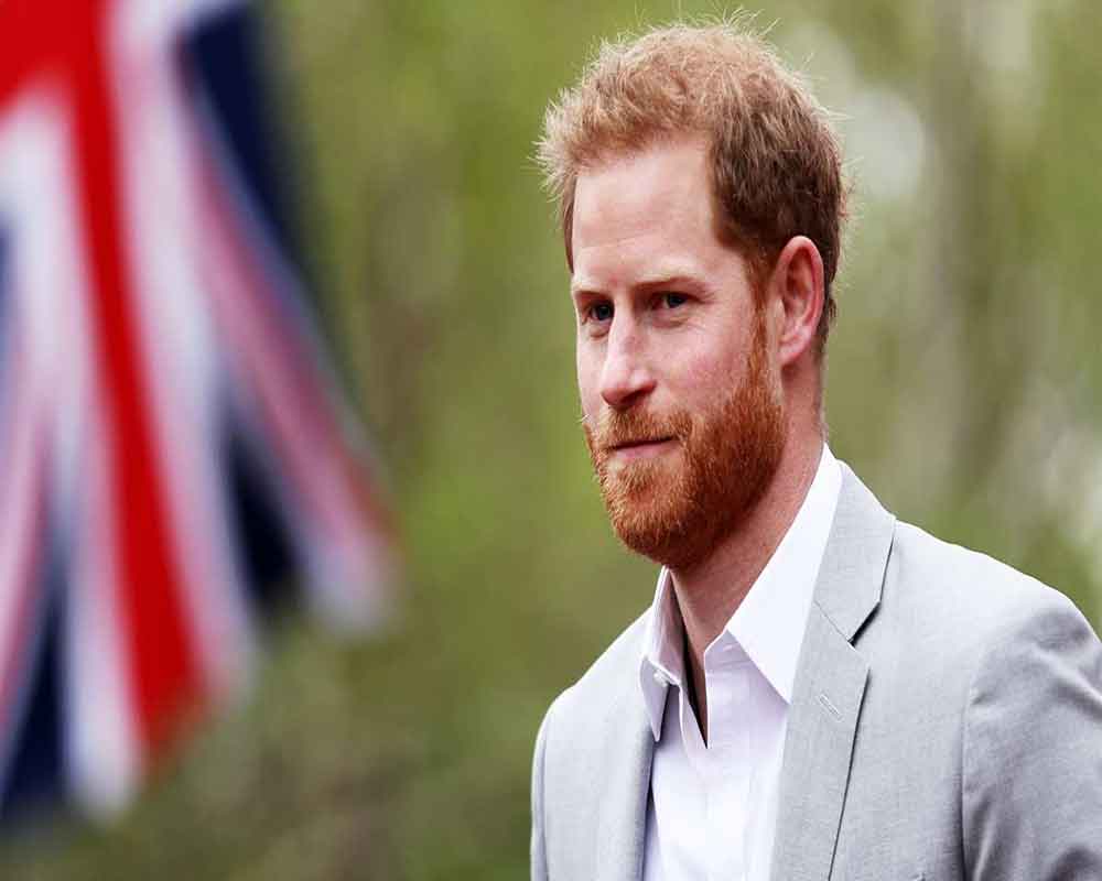 Prince Harry settles a case against a UK tabloid publisher that hacked his phone