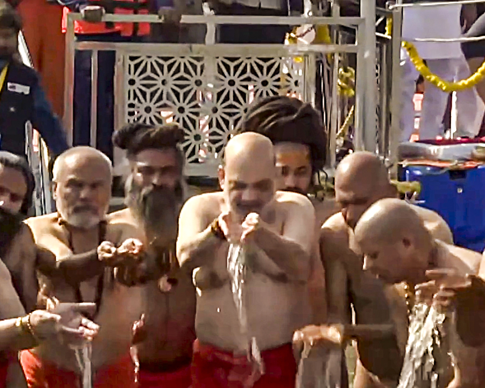 Maha Kumbh Amit Shah takes dip in Sangam