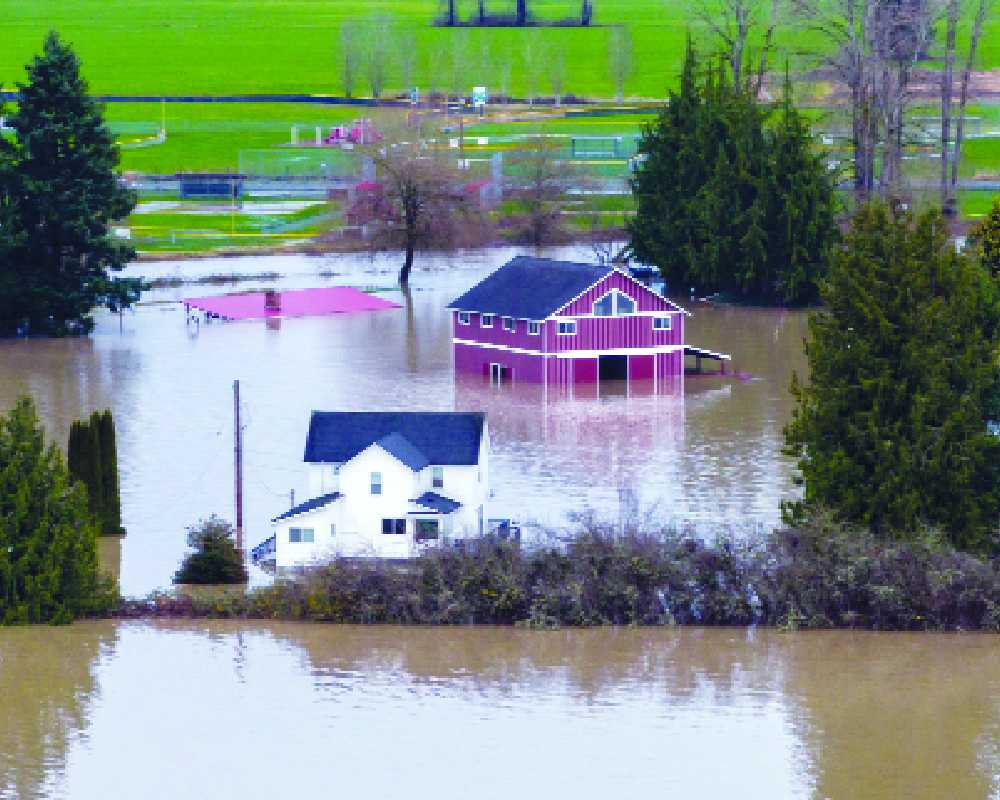 Washington floods sweep away homes, families stranded