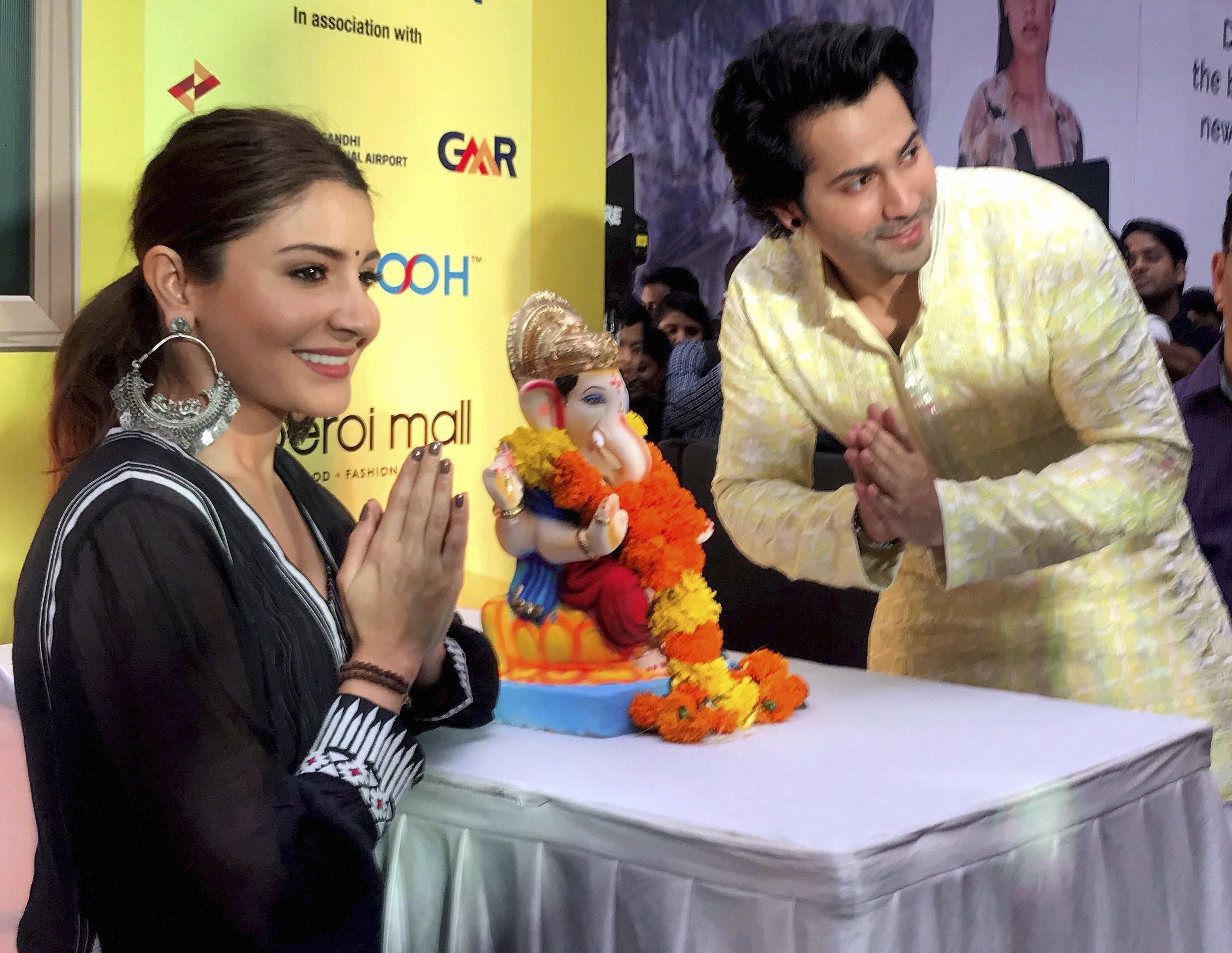 Bollywood actors Anushka Sharma and Varun Dhawan pose for photo during the launch of 'Green Ganesha', campaign, in Mumbai - PTI