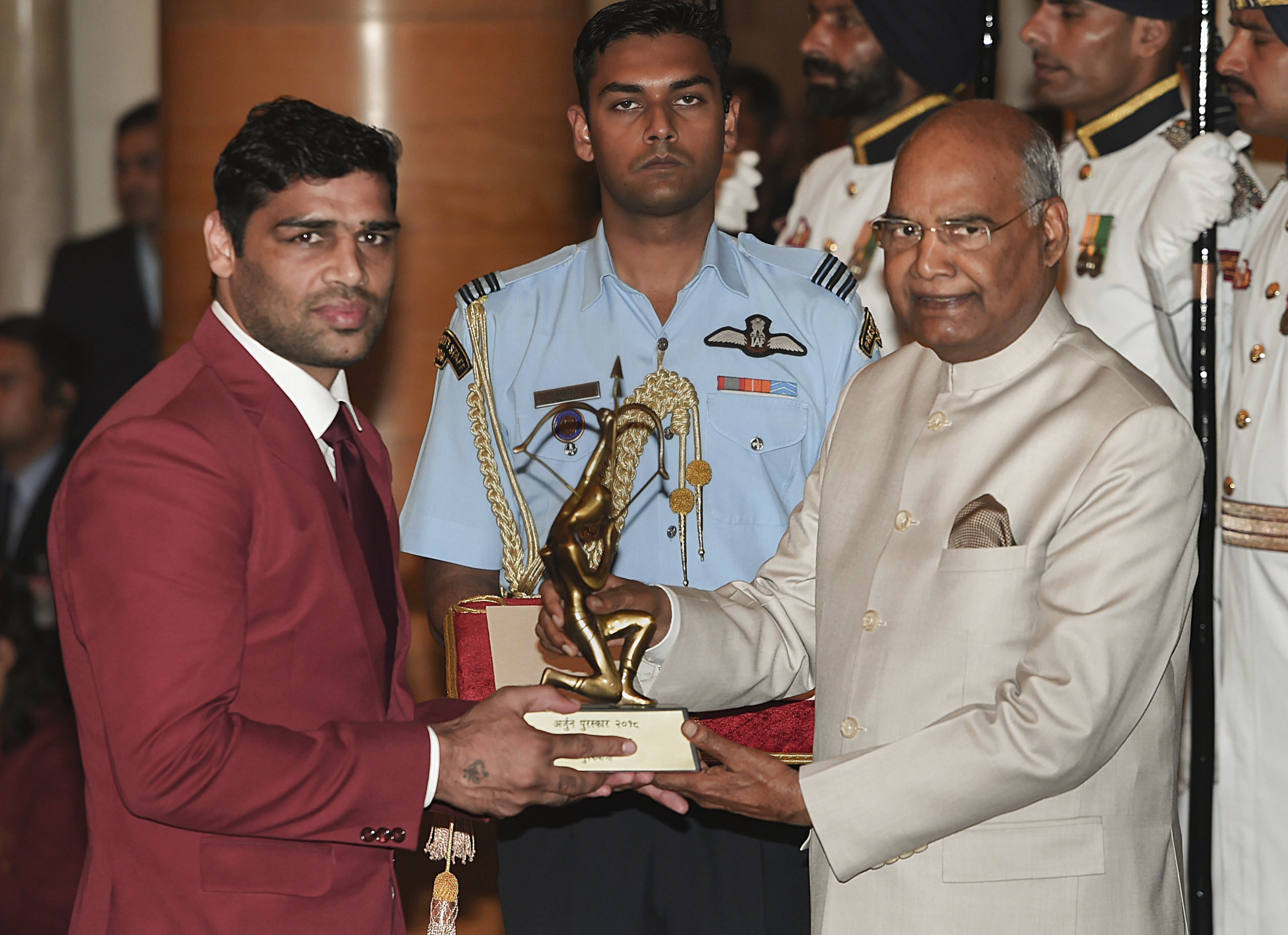 President Ram Nath Kovind presents Arjuna Award to boxer Satish Kumar at the National Sports and Adventure Award 2018 function at Rashtrapti Bhawan in New Delhi - PTI