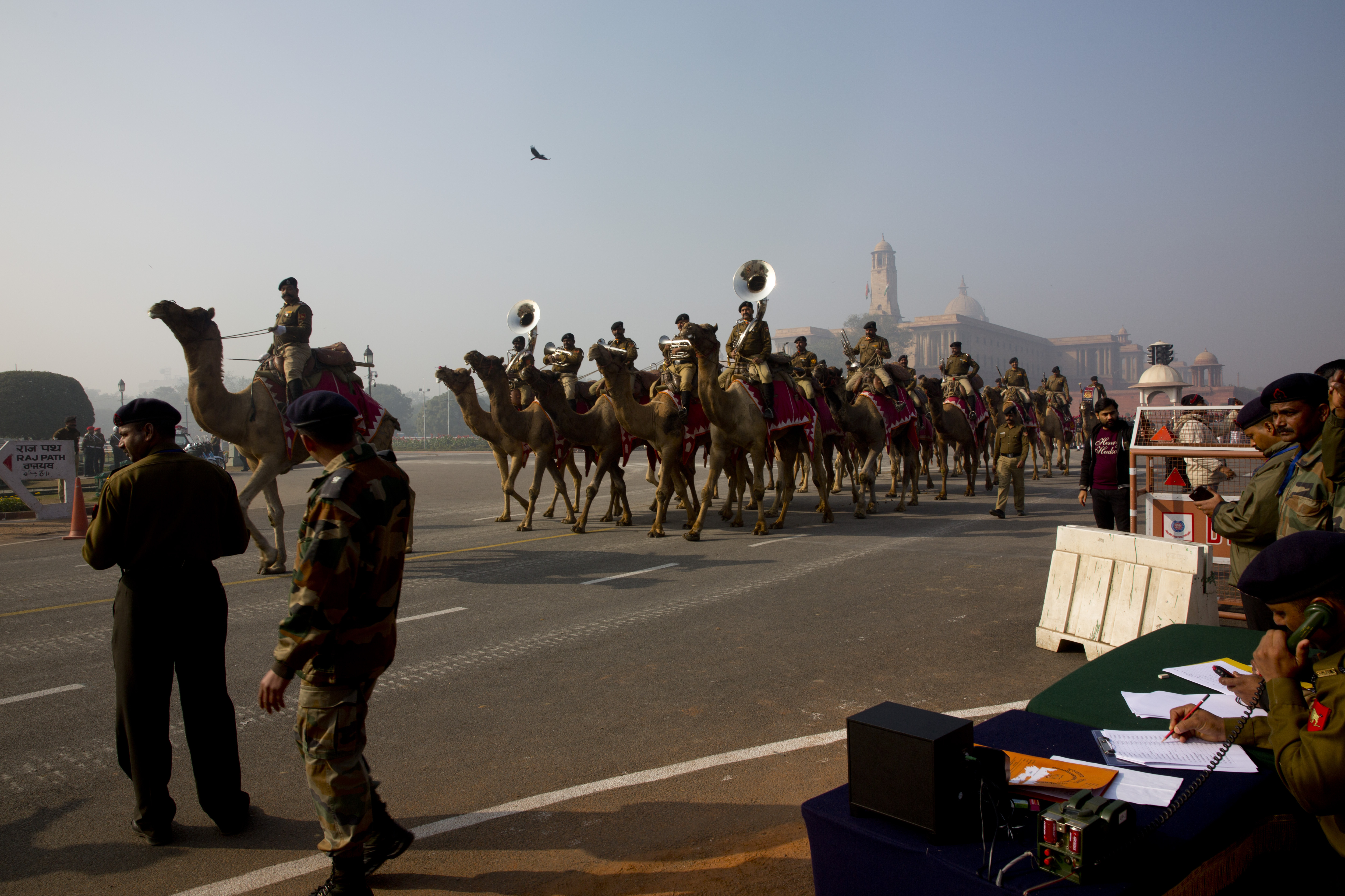 Camel mounted Indian Border Security force band march during the rehearsals for the upcoming Republic Day parade at the Raisina hills, the government seat of power, in New Delhi - AP