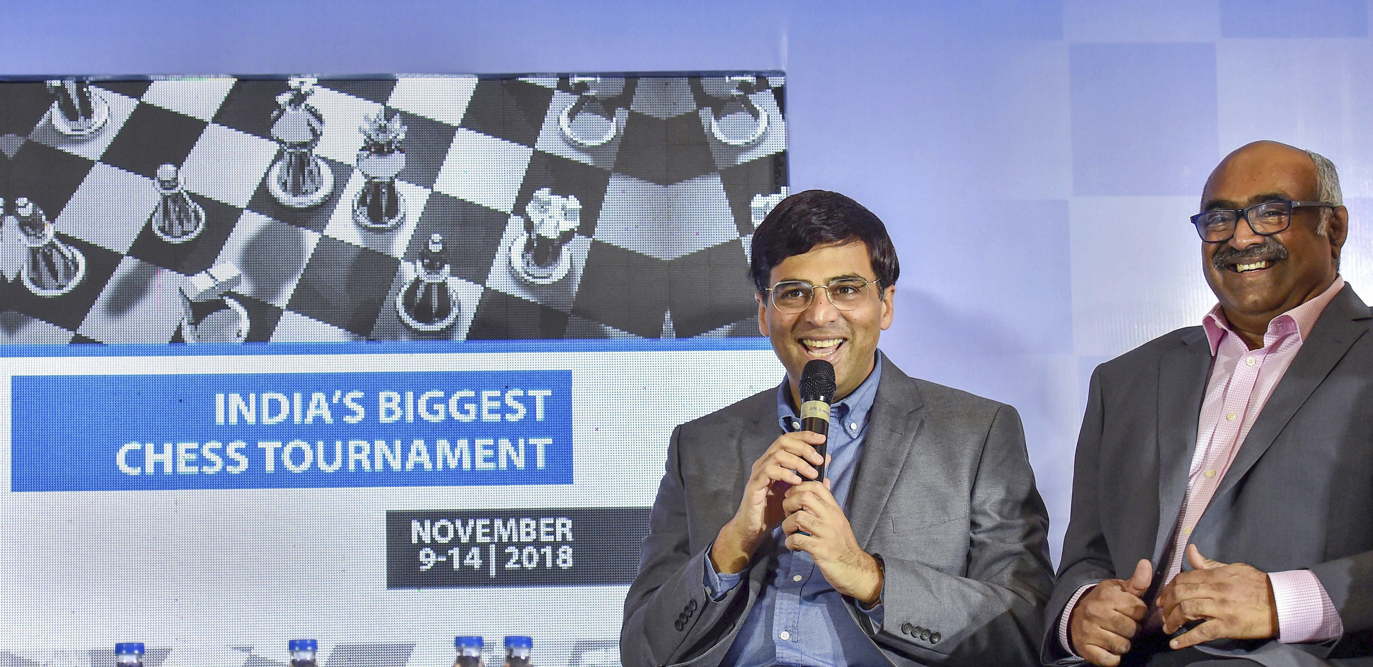 Chess Grandmaster Viswanathan Anand speaks as Tata Steel Vice-President Sunil Bhaskaran looks on during the launch of 'Chess India 2018', in Kolkata - AP