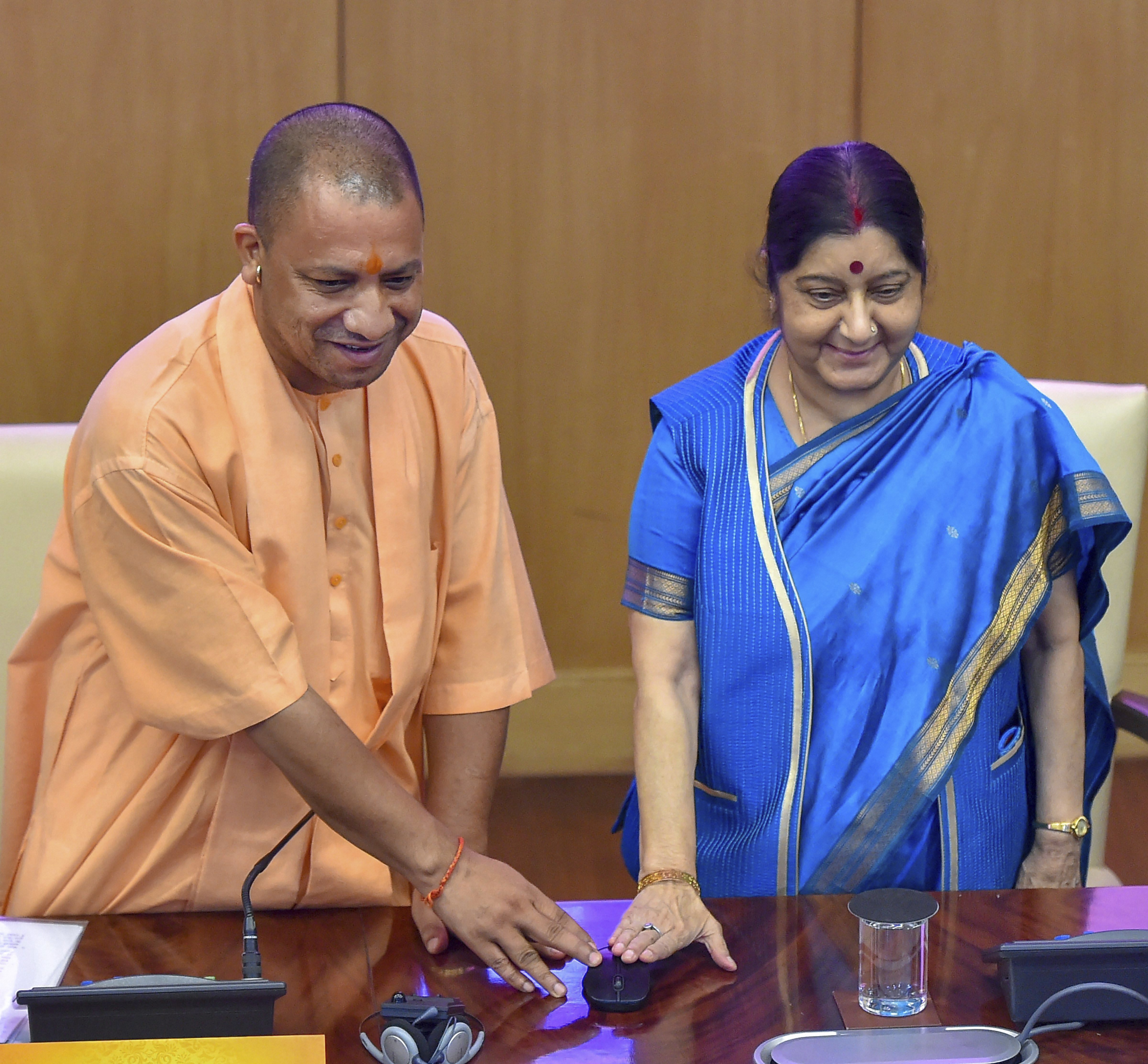External Affairs Minister Sushma Swaraj with Uttar Pradesh Chief Minister Yogi Adityanath launch the website for 15th Pravasi Bhartiya Divas, which will be held in Varanasi on January 21-23, in New Delhi - PTI