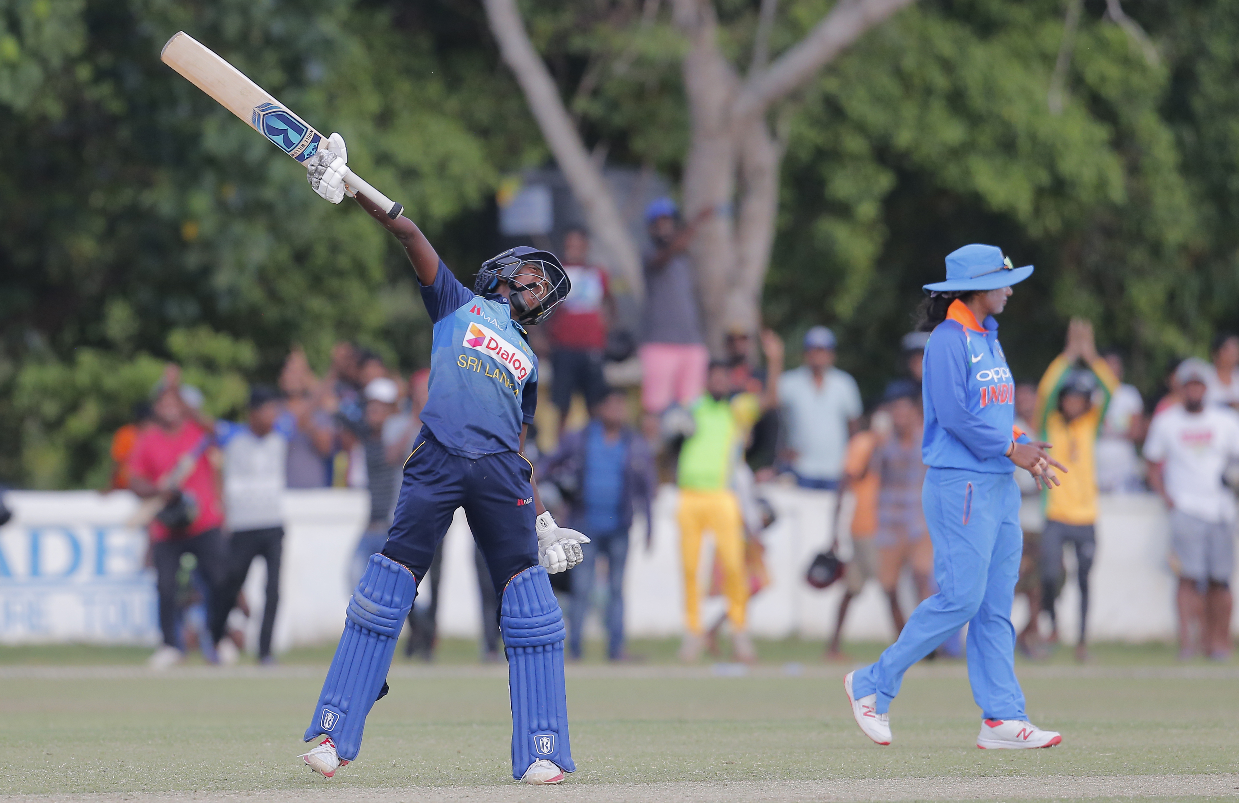 Sri Lanka's Kavisha Dilhari celebrates scoring the winning run to defeat India by three wickets in their third women's one day international cricket match in Katunayake - AP