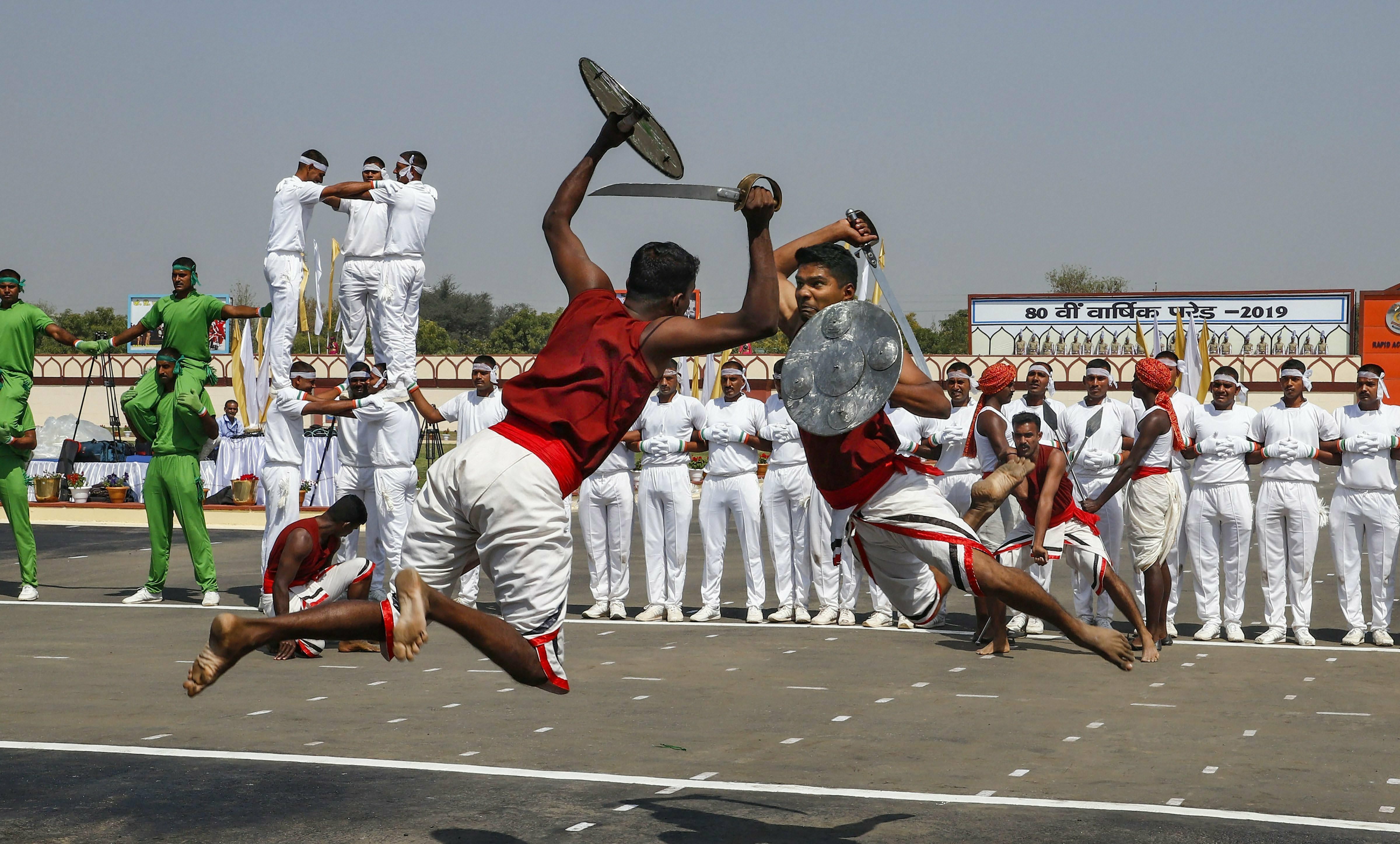 CRPF personnel perform Kalaripayattu, a traditional Indian martial art, during the 80th raising day of the Central Reserve Police Force (CRPF) in Gurugram - PTI