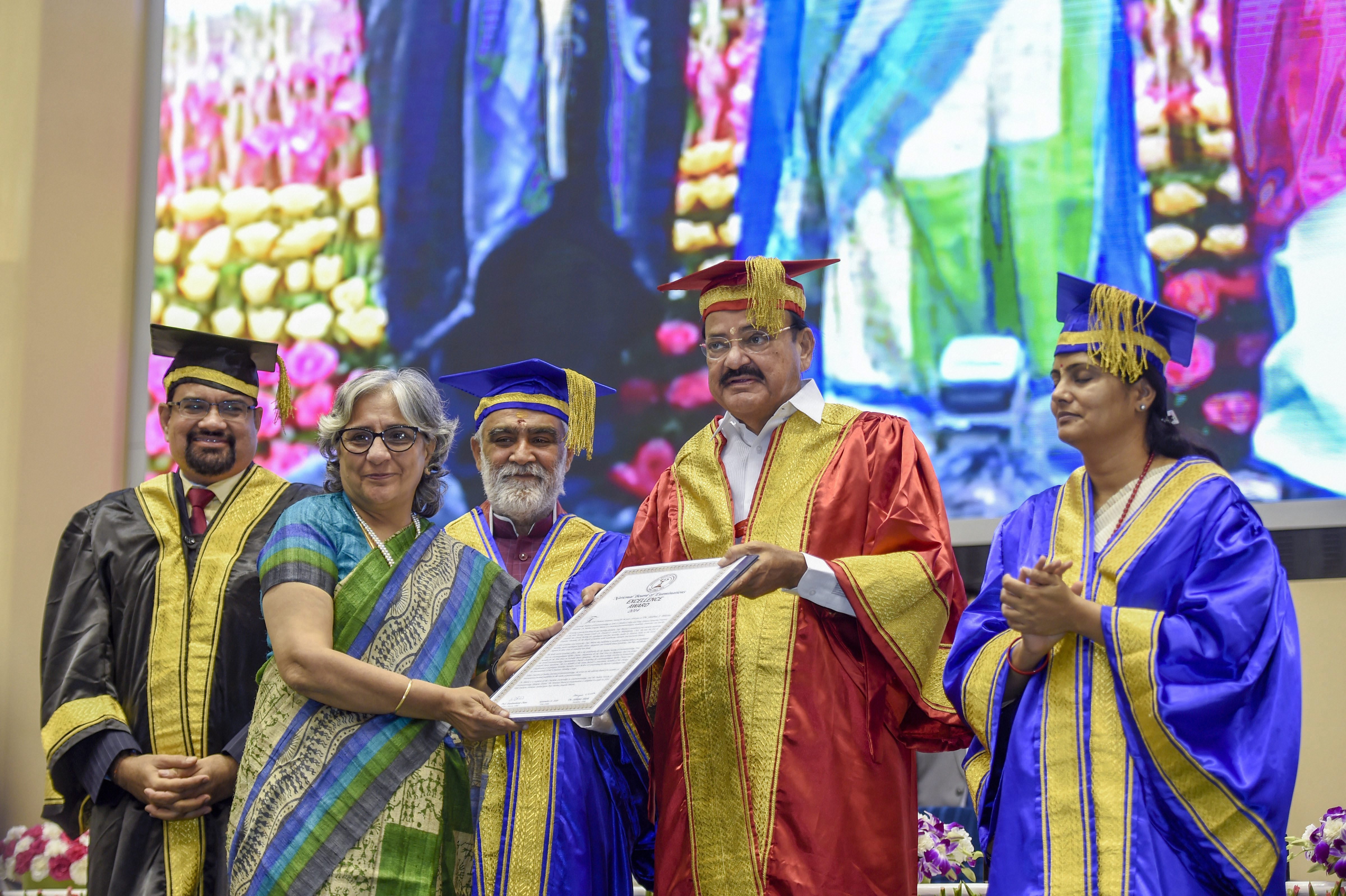 Vice President M Venkaiah Naidu presents an award during the 19th Convocation and Award Ceremony' of National Board of Examinations (NBE), in New Delhi - PTI