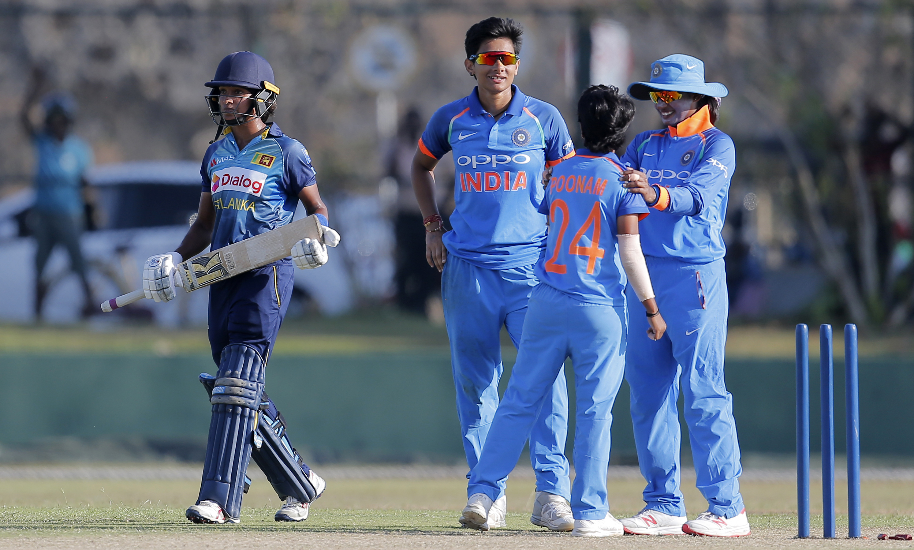 India's Poonam Yadav, back to camera, Mansi Joshi, second left, and Mithali Raj, right, celebrate the dismissal of Sri Lanka's Sripali Weerakkody during their second women's one-day international cricket match in Galle, Sri Lanka - AP
