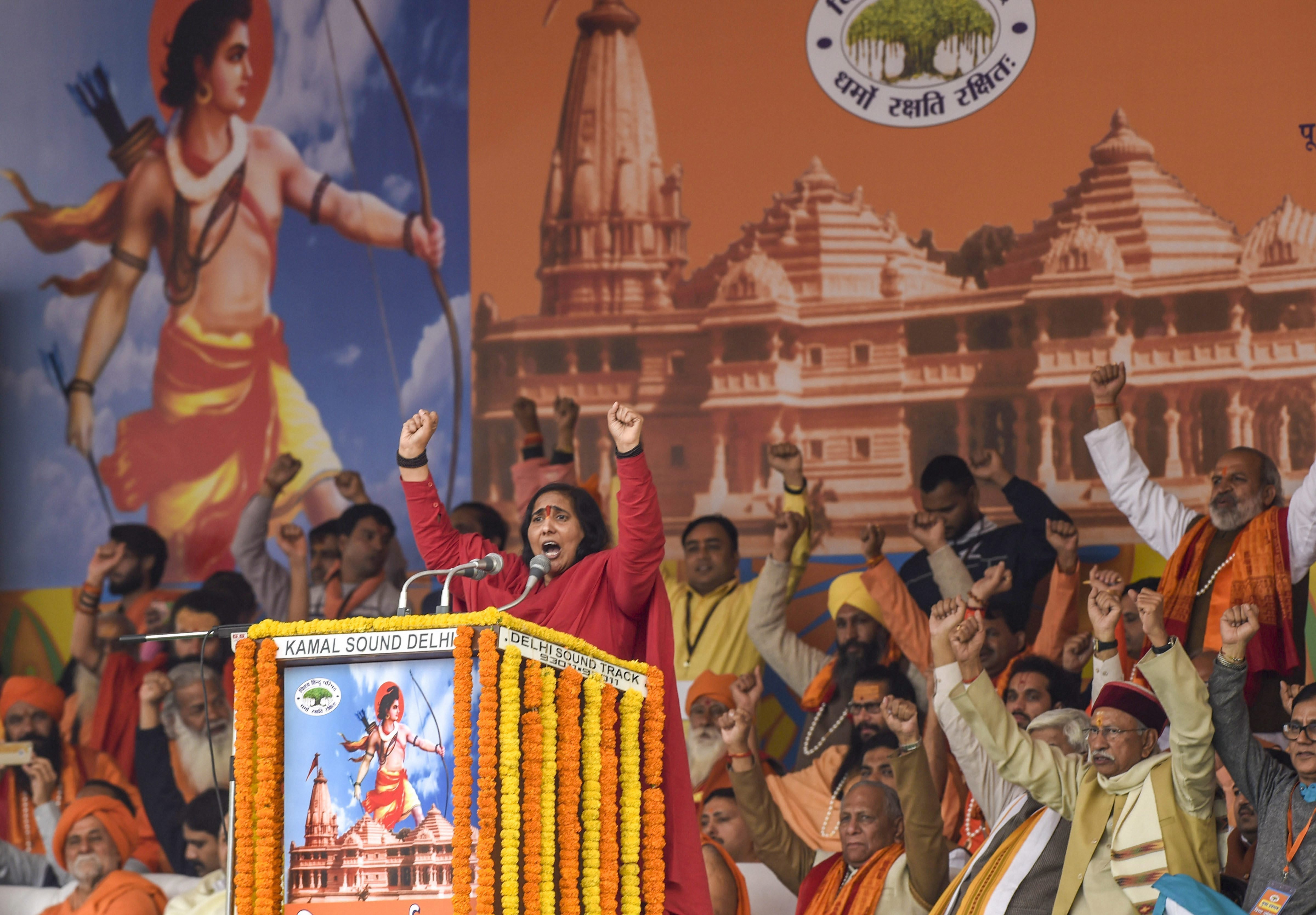 Hindu activist Sadhvi Ritambhara addresses during Vishwa Hindu Parishad's (VHP) 'Dharma Sabha', in which thousands of people gathered at Ramlila Maidan to press for the construction of Ram Temple in Ayodhya, days before Parliament's winter session commences, in New Delhi - PTI