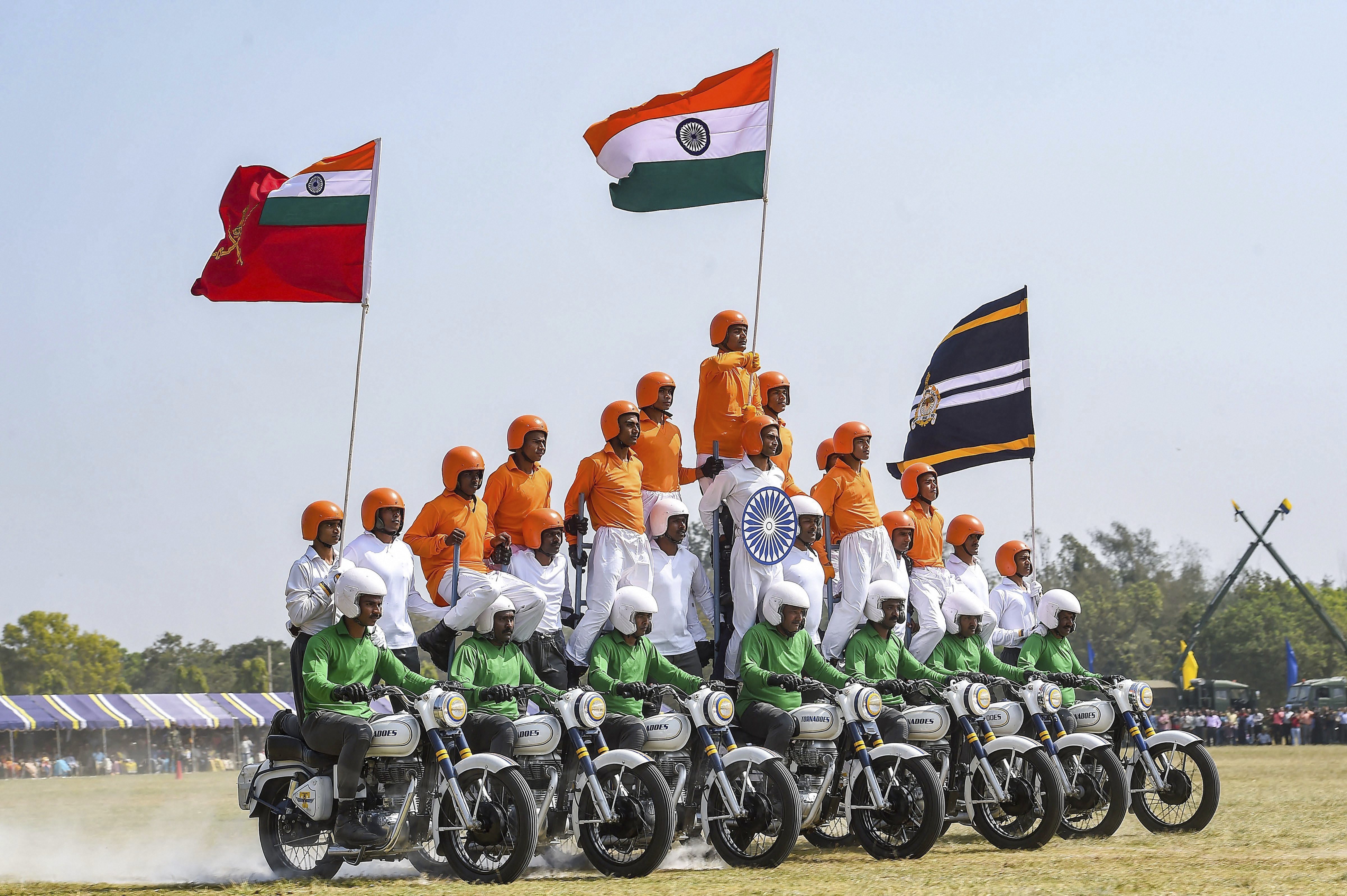 A motocycle team 'Tornadoes' of Army Service Corps display their skills during the celebration of 258th anniversary of Army Service Corps (ASC), in Bengaluru - PTI