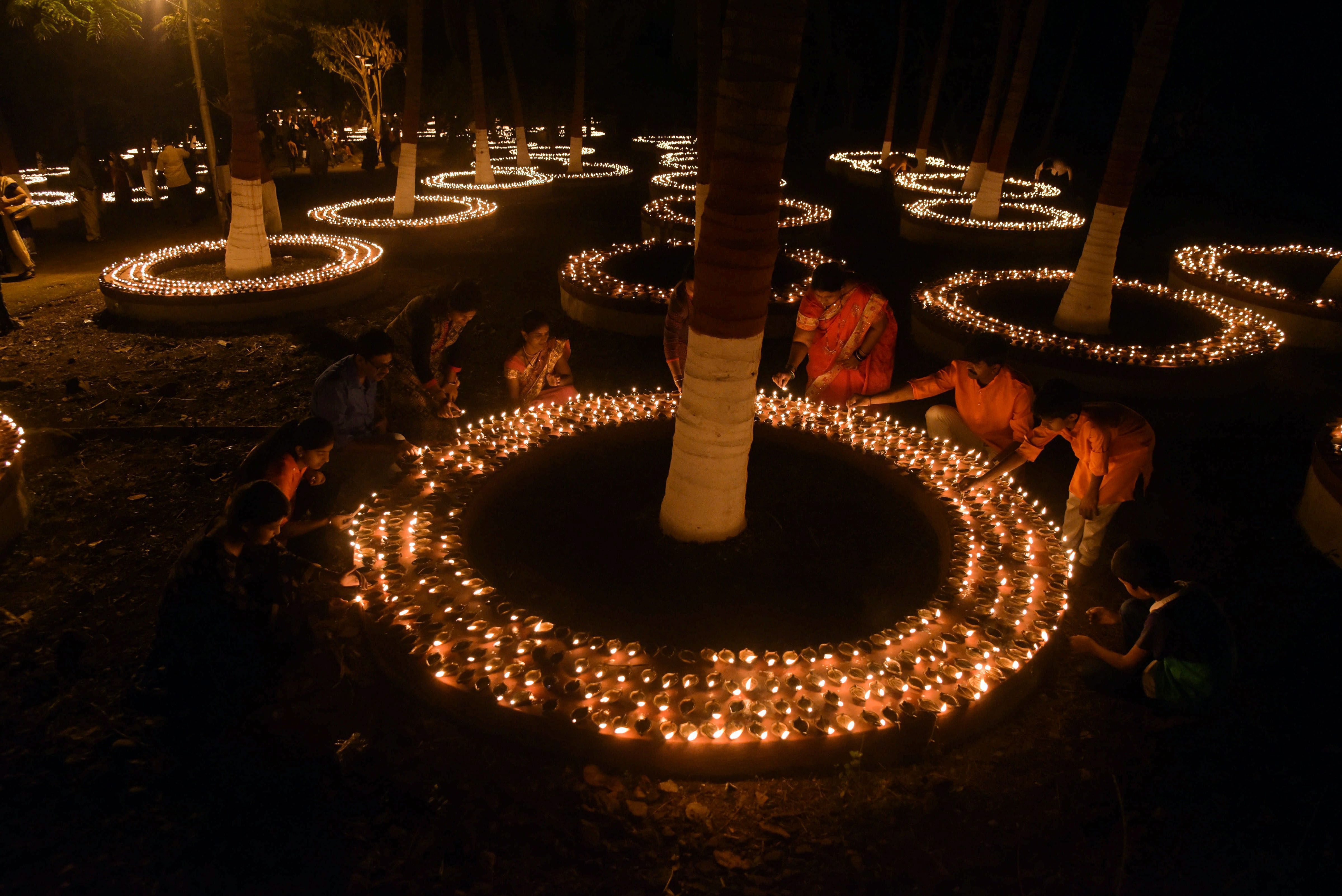 People light lamps on occasion of Kojagiri Pournima 