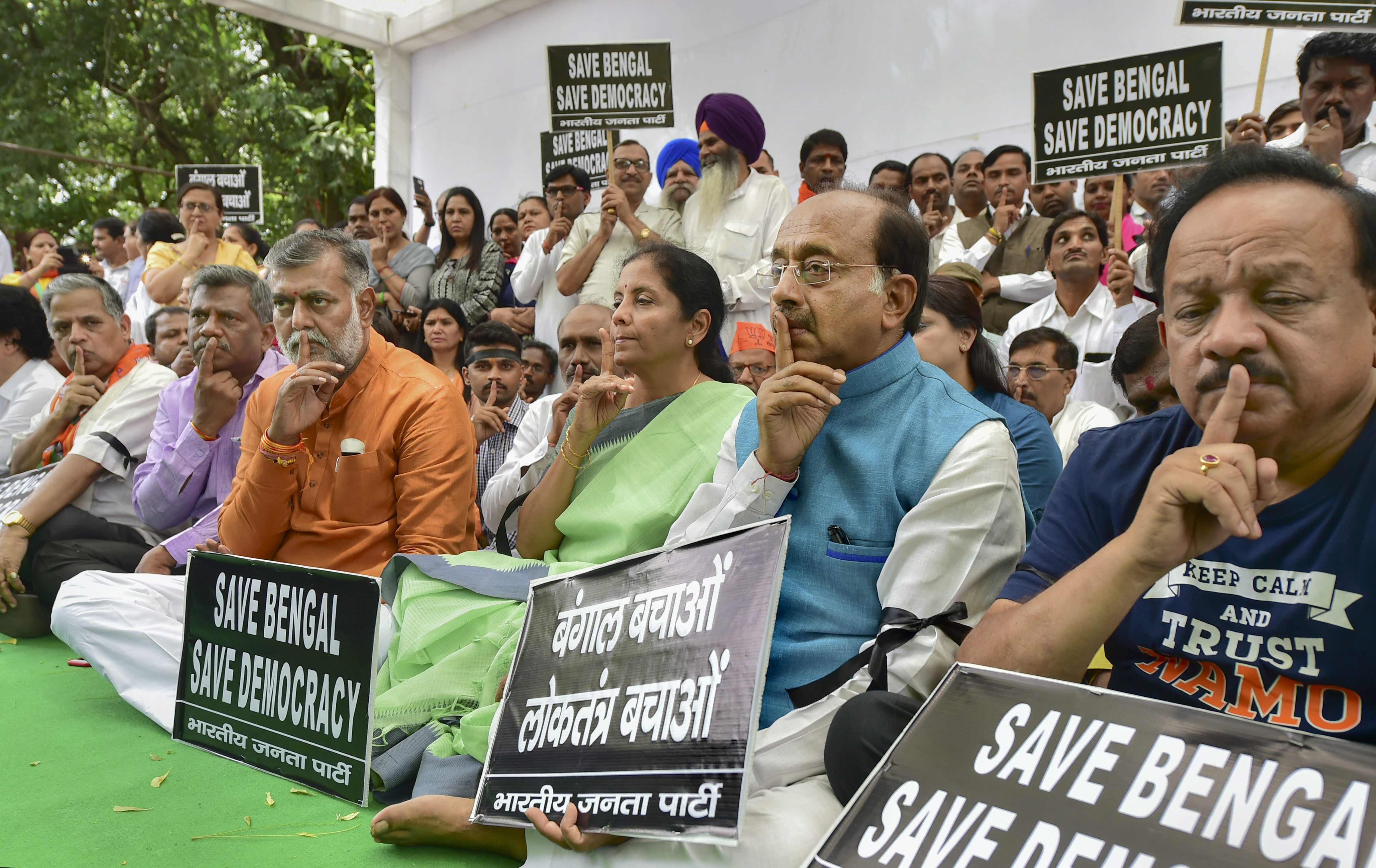 BJP leaders Harsh Vardhan, Vijay Goel, Nirmala Sitharaman and others take part in a silent protest against the clashes that broke out during BJP President Amit Shah's roadshow in Kolkata yesterday, in New Delhi - PTI