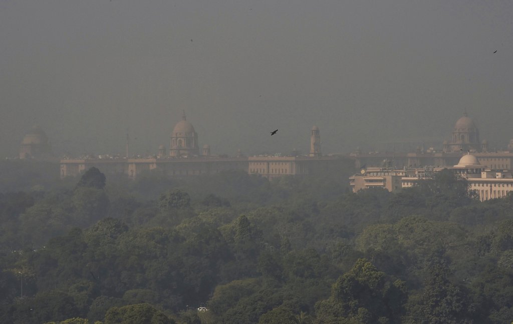 A view of the Rashtrapati Bhawan , South and North Block buildings enveloped in a blanket of smog, caused by a mixture of pollution and fog, in New Delhi - PTI