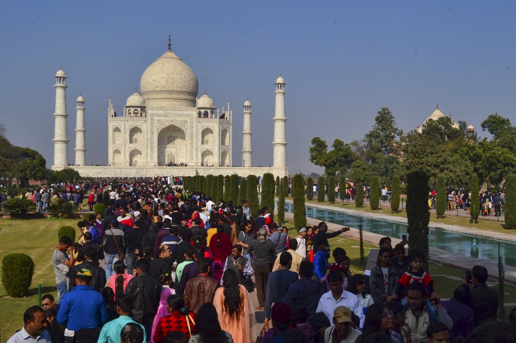 Tourists visit Taj Mahal on the last weekend of the year, in Agra - PTI