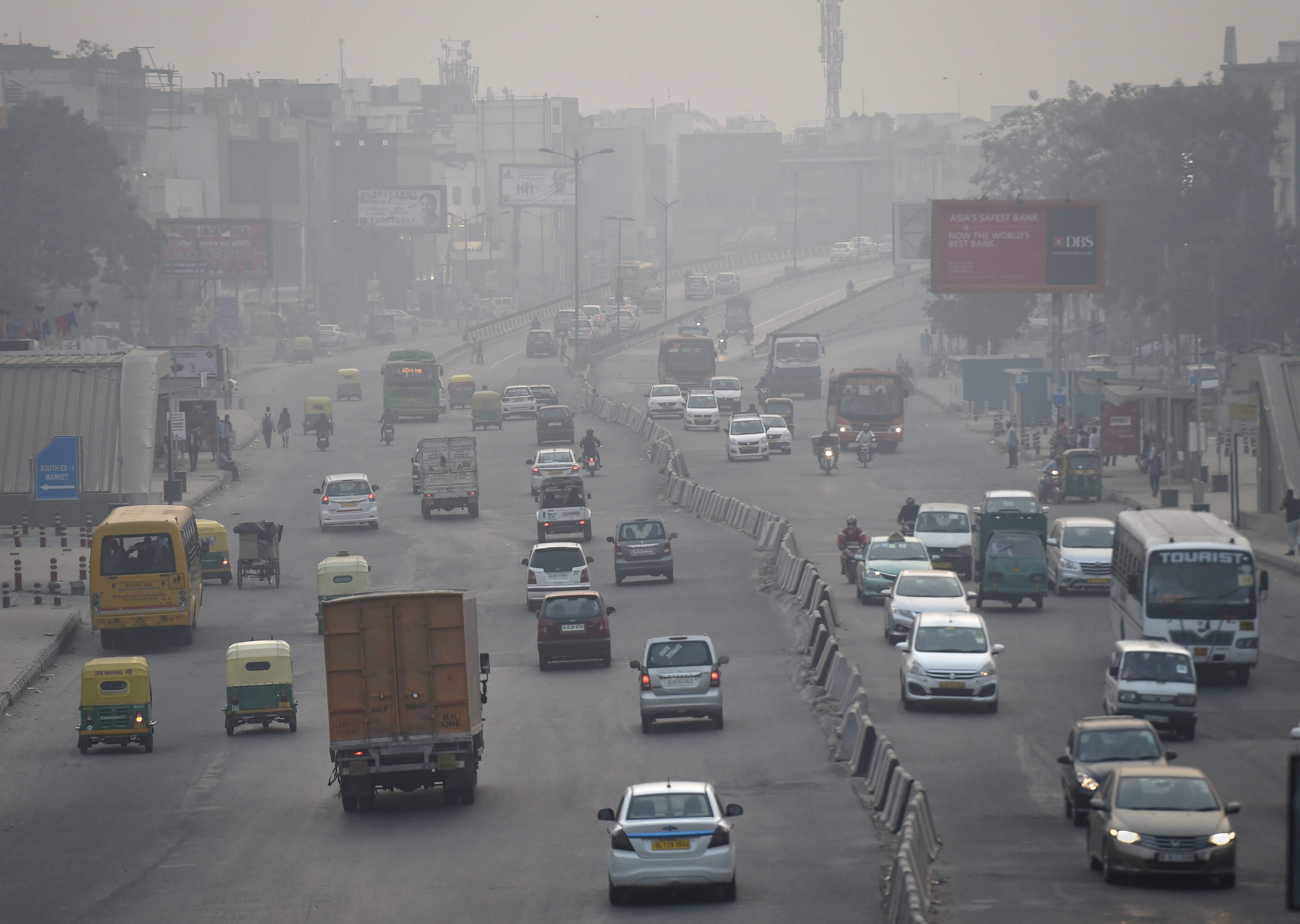 Vehicles ply on a road as thick haze engulfs the city, in New Delhi - PTI