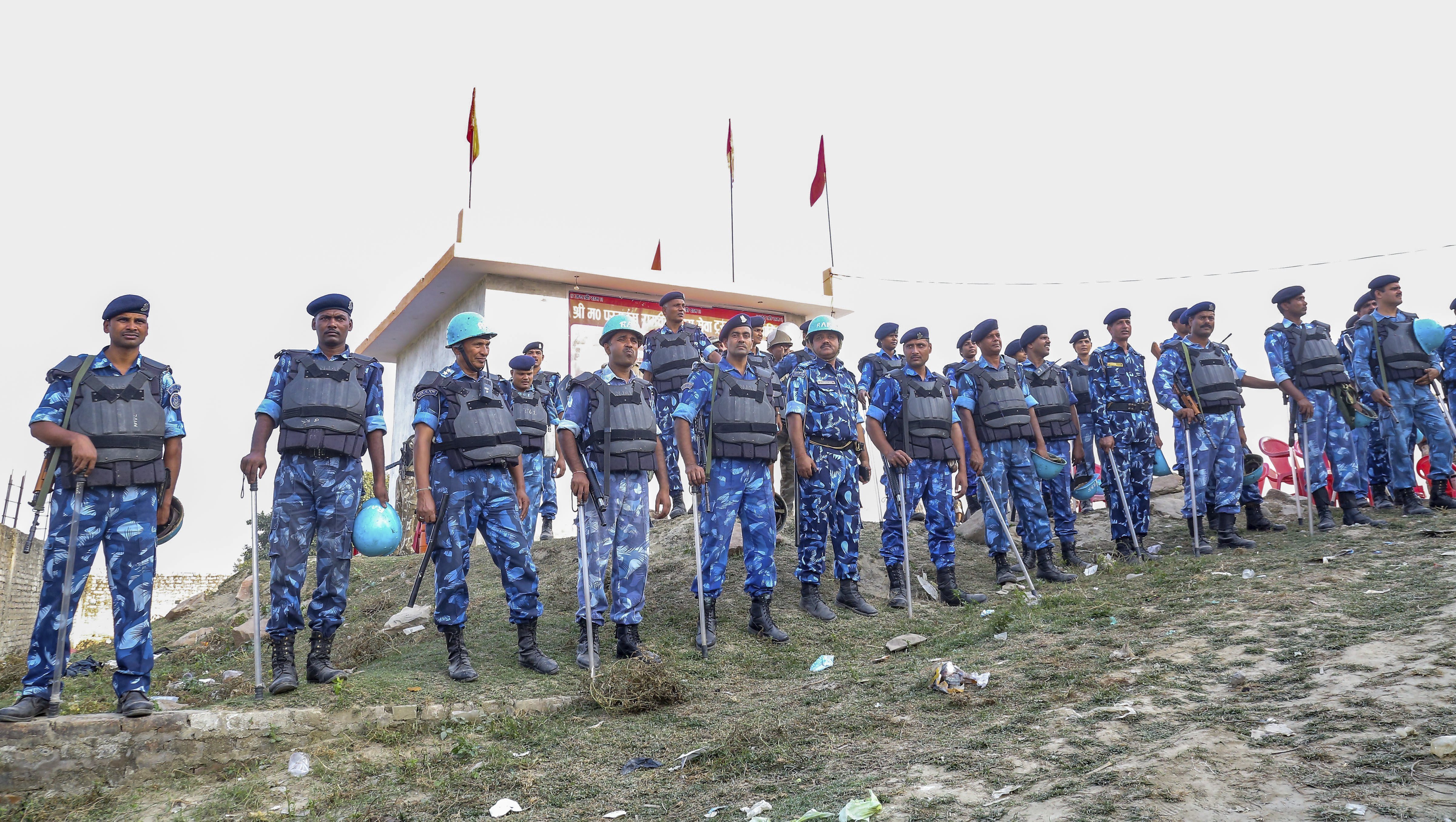 RAF personnel stand guard during Antarrashtria Hindu Parishad president Pravin Togadia's rally near the 'samadhi' of Ram Chandra Paramhans, in Ayodhya - PTI