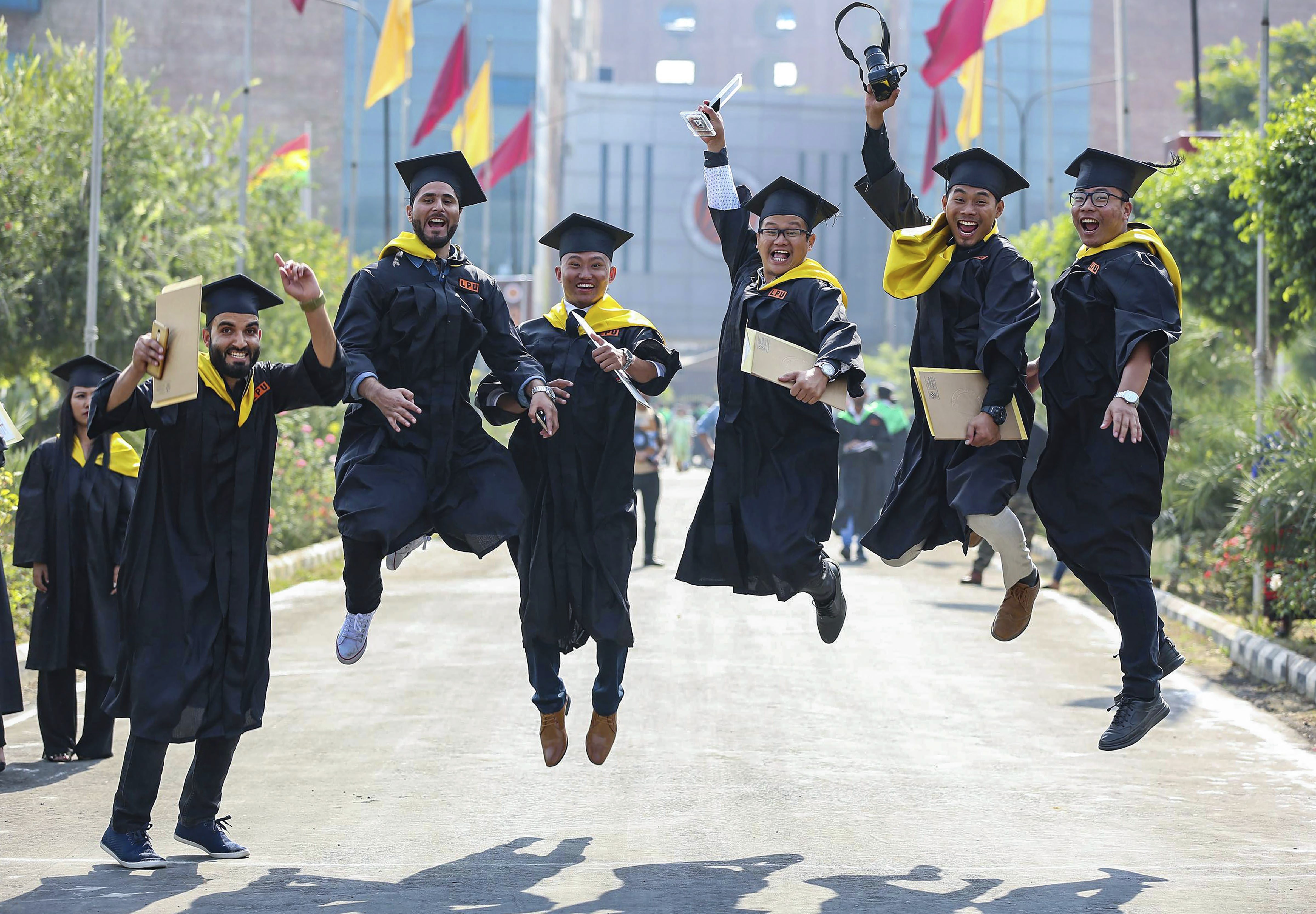 Students jubilate after the convocation ceremony at University of Jalandhar, in Jalandhar - PTI