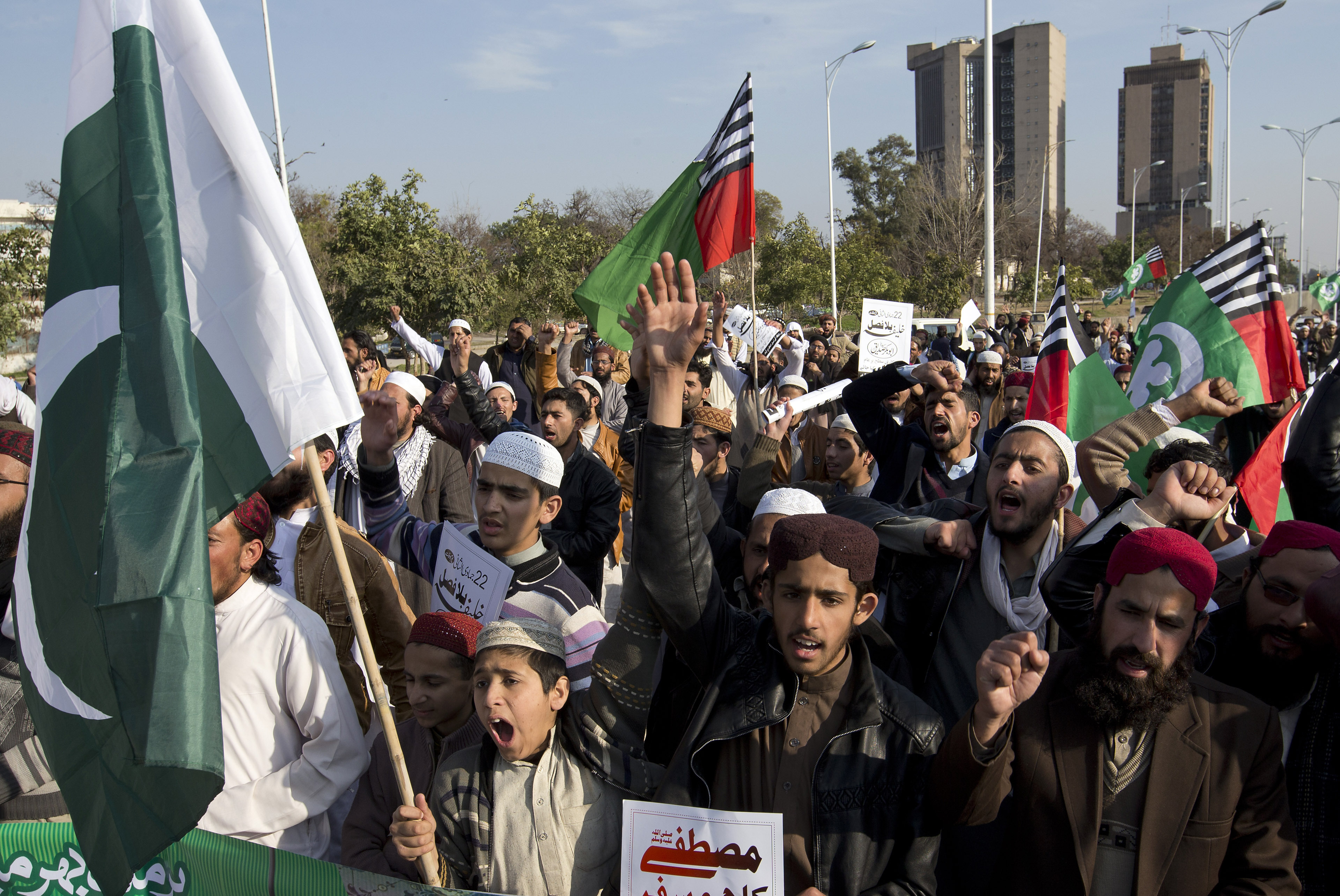 Pakistani religious students rally against India in Islamabad - AP