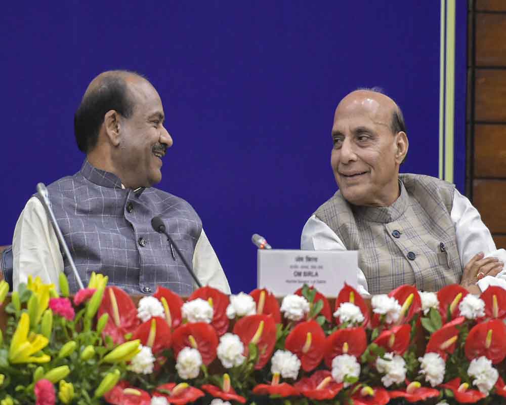 Lok Sabha Speaker Om Birla with Defence Minister Rajnath Singh during an orientation programme organised for the newly-elected Lok Sabha members at Parliament Annexe in New Delhi - pti